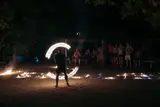 Fire dance performance on the beach at night during the Seatours 3D2N El Nido to Coron expedition island camp