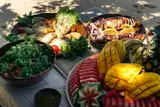 Fresh grilled seafood, salad, and tropical fruit served during a Seatours semi-private speedboat day tour in El Nido